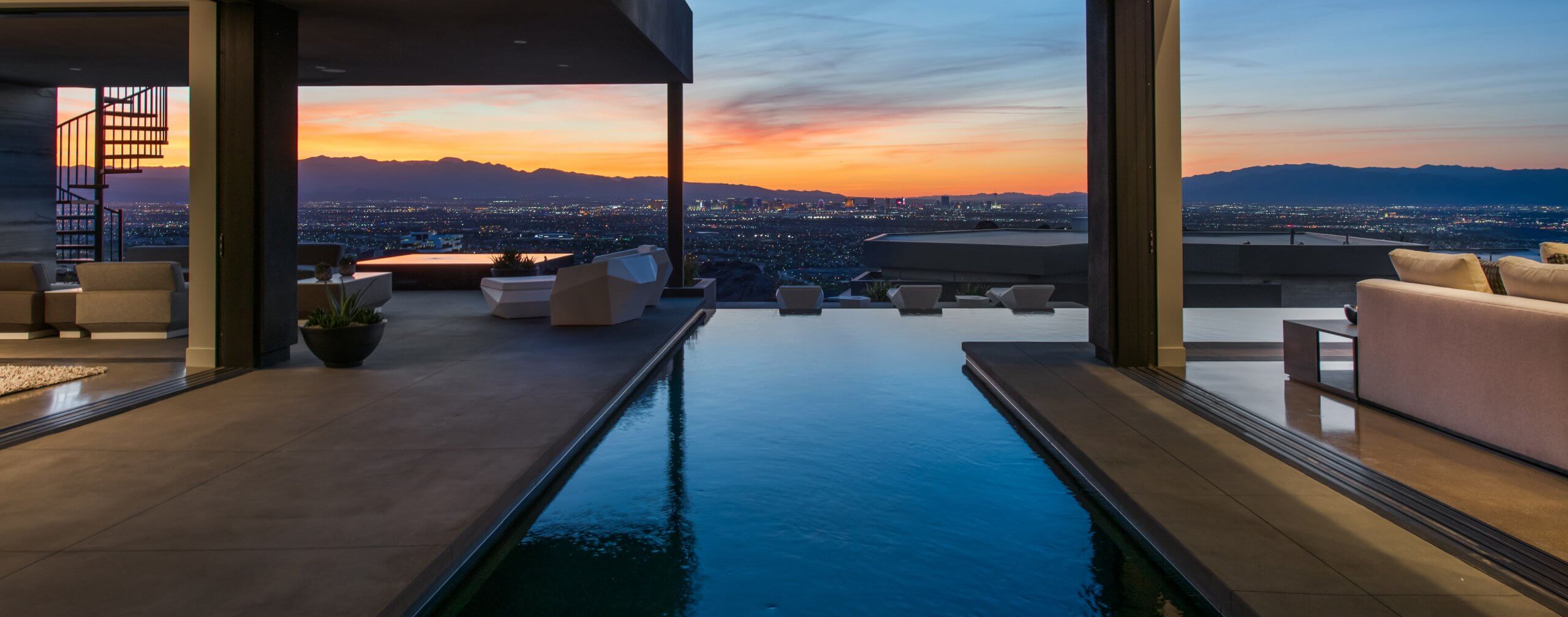Living in MacDonald Highlands in Las Vegas offers a luxurious and exclusive residential experience with stunning views of the city and surrounding mountains.